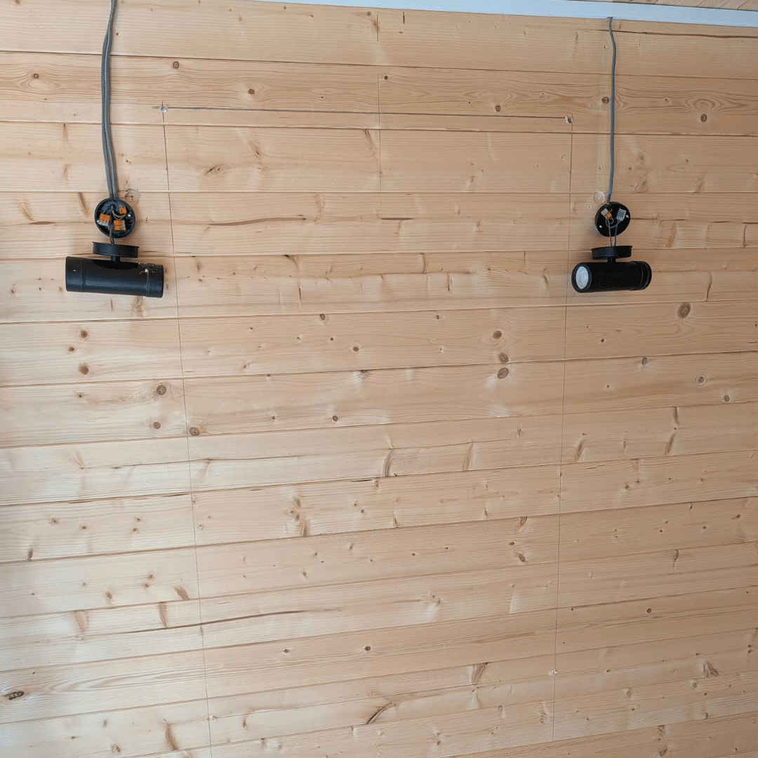 Inside log cabin before cutting new window opening in Hempstead Medway